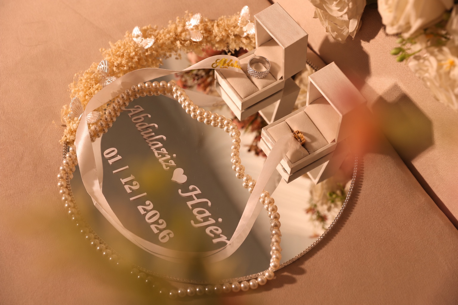 Our wedding rings, with our names and wedding date